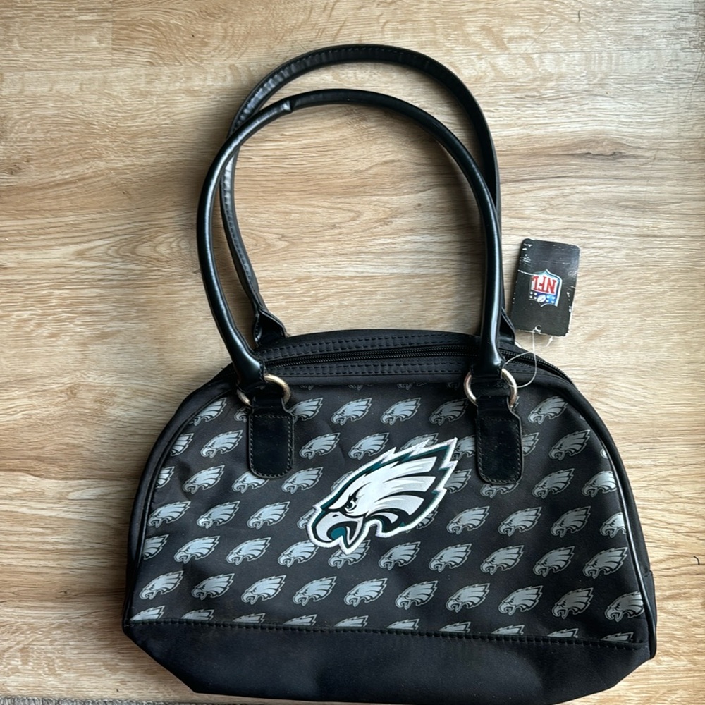 Unisex Official Eagles NFL sports bag. Black and leather handles and zipper